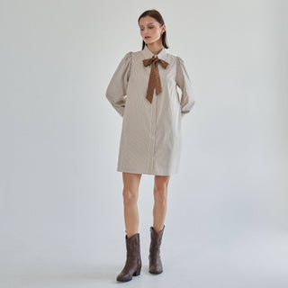 Marguerite striped shirt dress styled with boots, angled view
